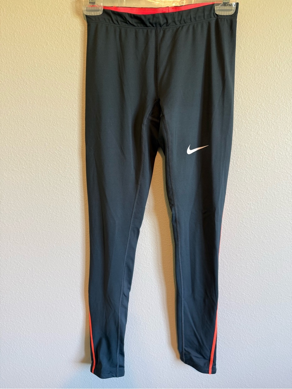 Nike Grey Leggings with Orange Trim and White Swoosh